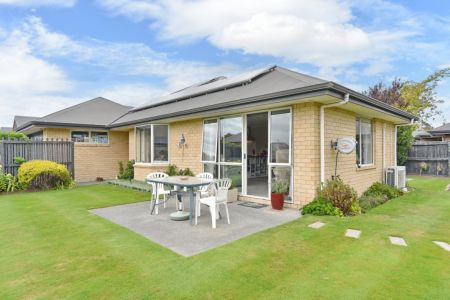 Sun-Soaked And Easy-Care With Double Garage!