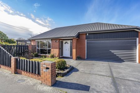 Sunny And Spacious With Double Garaging!