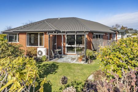 Sunny And Spacious With Double Garaging!